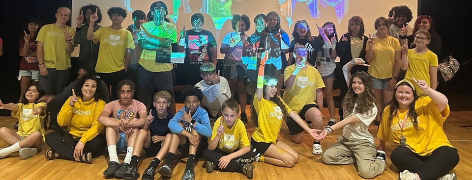 Sollovare winning pictures with a group of students